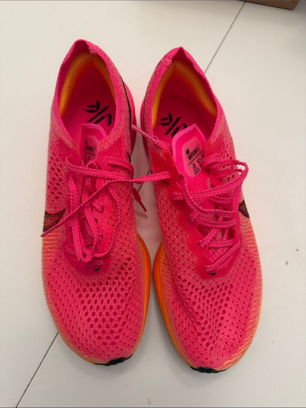 Nike Women's Neon Pink Flyknit Running Shoes with Orange Sole